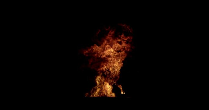 Combustion fire explosion overlay. VFX effect on black screen background. Fire igniting from the bottom of the screen and resolving upwards. Destruction and pyrotechnics concept.