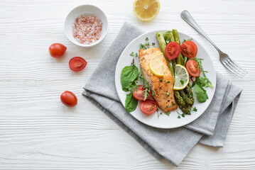 Baked Delicious salmon, green asparagus on  plate