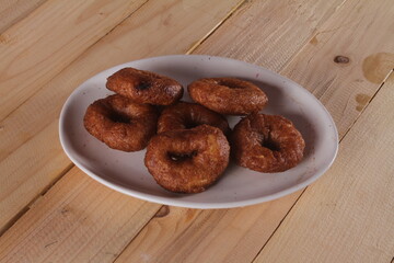 Ali agrem cake is a traditional Sundanese food originating from Karawang, which at first glance looks similar to a donut because it is round and has a hole in the middle. 
