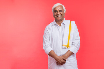 Happy senior man in traditional south Indian clothing