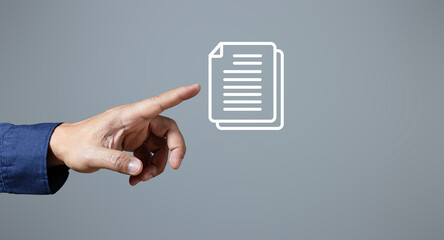 Male hand pointing at document icon on gray background. business information system internet technology document management concept Enterprise Information Management System DMS. © Alek