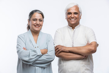 Portrait of loving senior couple over white background