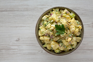 Homemade Potato Egg Salad with Pickles in a Bowl, top view. Flat lay, overhead, from above. Space for text.
