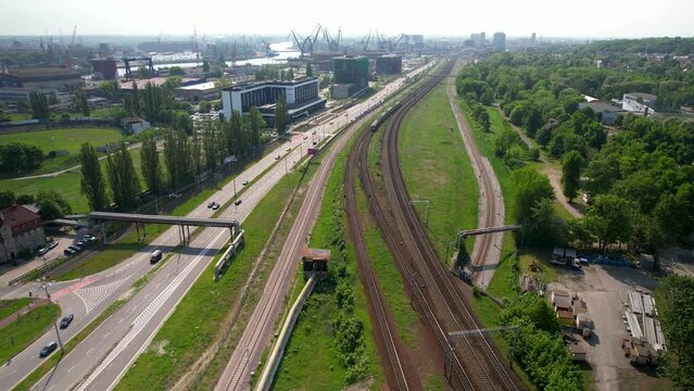 Aerial View Of Railway Lines Beside Motorway D91 Is Gdansk. Dolly Back Shot