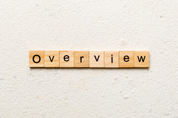 OVERVIEW word written on wood block. OVERVIEW text on cement table for your desing, concept