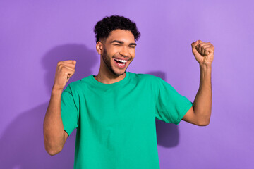 Photo of funny cool nice multinational guy excited lottery jackpot winning wear green shirt...