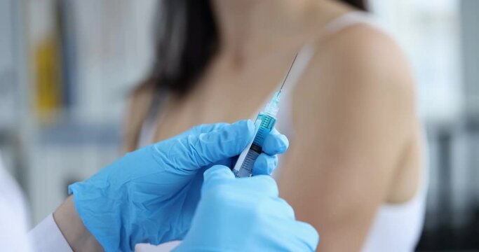 Syringe with vaccine in hand rejection gesture. Refusal and prohibition of vaccination concept