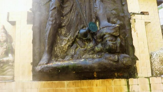 ancient shiva statue with natural holy hot spring water at day from different angle