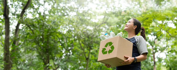 woman holding a garbage box recycling concept Recycle, recycle, plastic-free, junk food plastic...