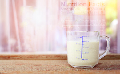 World milk day concept - Glass of fresh cold rustic cow milk - high protein and calcium on a wooden...