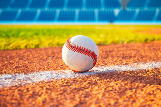 Single Baseball on Orange Dirt Field Line