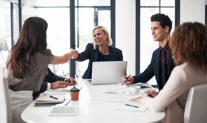 Business people, handshake and meeting for hiring, partnership or collaboration at office conference. Happy woman shaking hands with employee in recruiting, team growth or agreement deal at workplace
