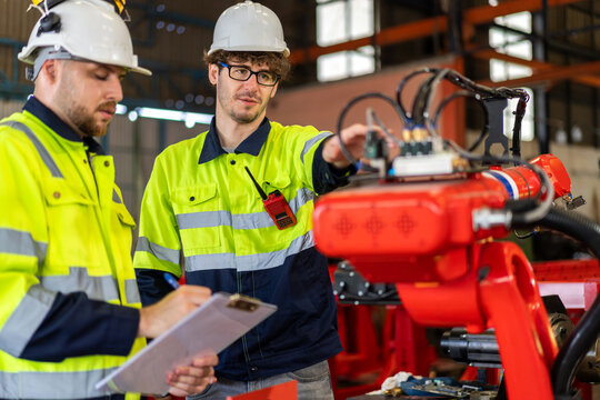 Professional team labor machanic engineer technician worker industrial work control with machine, manufacturing, factory, production line, Indusry 4.0, robot, industrial facility.business planning
