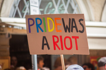 A sign says: "Pride was a riot" during the Gay Pride celebration in Munich