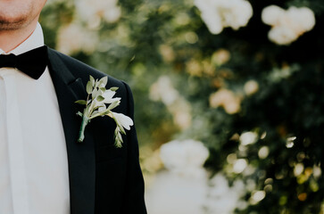 groom with flowers
