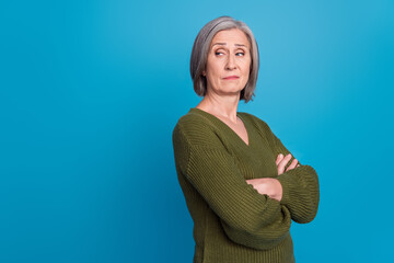 Photo of egoist selfish businesswoman pensioner wear khaki jumper folded hands look empty space...