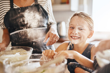 Flour, playing or portrait of girl baking in kitchen with a messy young kid smiling with a dirty face at home. Smile, happy or parent cooking or teaching a fun daughter to bake for child development