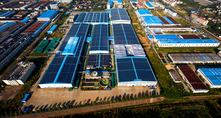 Aerial photography of solar photovoltaic panels built on the roof of a factory building