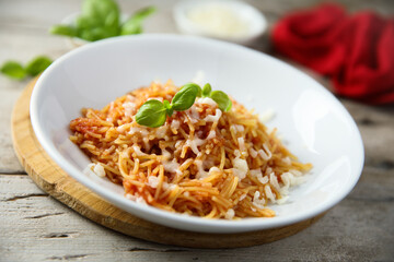 Homemade pasta with tomato and cheese