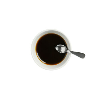 The image is an up-close shot of a cup of espresso coffee, placed on a table.