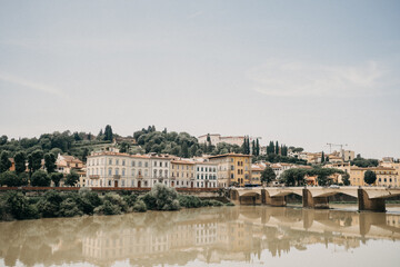 A view of the glassy Arno river