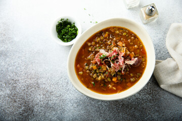 Homemade lentil soup with smoked bacon