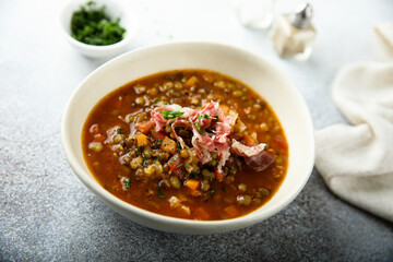 Homemade lentil soup with smoked bacon