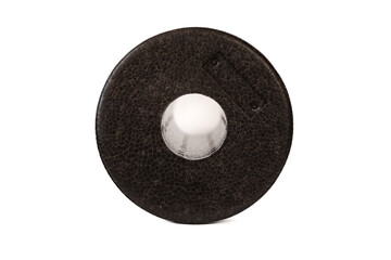 A black massage foam roller isolated on a white background. Close-up. Foam rolling is a self myofascial release technique. Concept of fitness equipment.