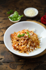 Homemade pasta with tomato and cheese