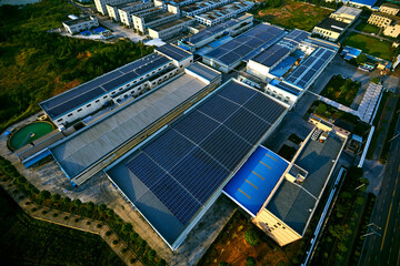 Aerial photography of solar photovoltaic panels built on the roof of a factory building