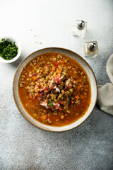 Homemade lentil soup with smoked bacon