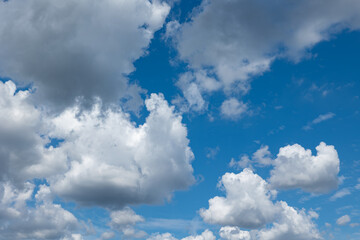 Blue sky with cumulus clouds during summer. Wheater, meteorology, atmosphere and overcast.