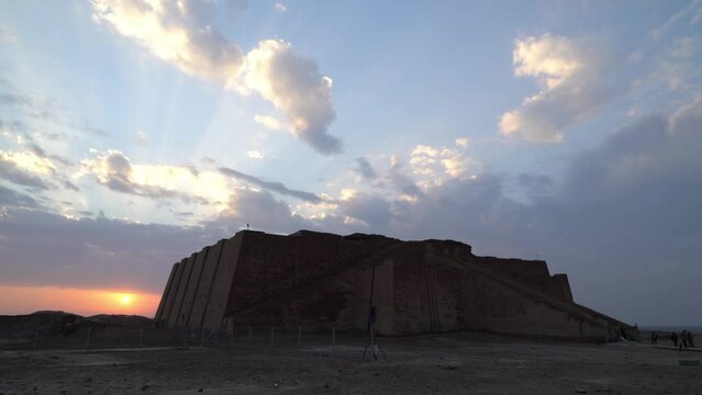 Ziggurat of Ur with sky illuminated by sun rays at dusk, Nasiriyah in Iraq. Panning