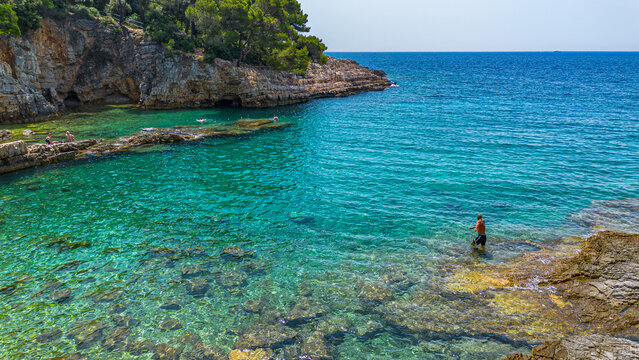 Aerial view of  Famous Cyclone beach near Pula. Rocks in clear water. Istria. Croatia