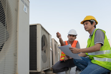 Engineers use blueprint check air condition systems on site. Contractor and inspector inspection...