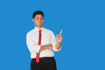 Asian male party cadre in tie pointing up with number one finger smiling confident and happy for...