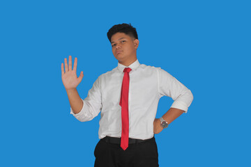 Asian male party cadre in tie pointing up with number five finger smiling confident and happy for election campaign isolated on blue background.
