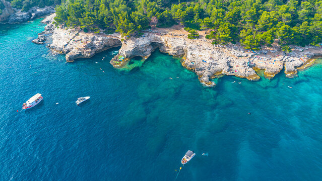 Aerial view of  Famous Cyclone beach near Pula. Rocks in clear water. Istria. Croatia