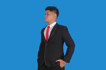 Asian man with serious expression wearing black suit