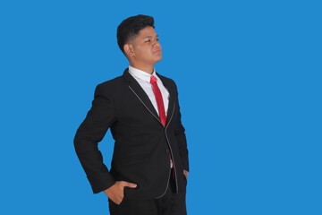 Asian man with serious expression wearing black suit