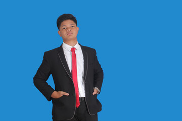 Asian man with serious expression wearing black suit