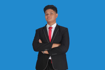 Asian man with serious expression wearing black suit