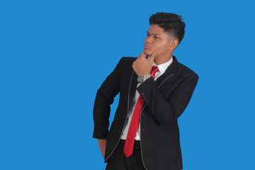 Side view of a confused man with his hands holding his head, pose and expression of considering something