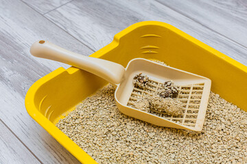 scoop for cleaning cat litter with waste