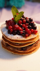 Delicious pancakes with fresh berries