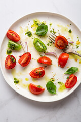 Close up of tomato  salad with pesto leftover food