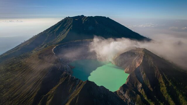 Aerial view flying to mount Kawah Ijen crater, Sulfur mining in an active volcano, Java, Indonesia 
