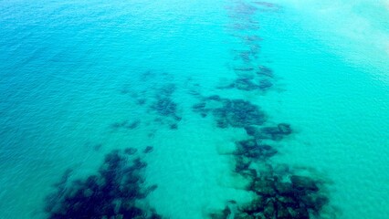 Obraz premium aerial view of clear blue-turquoise sea, atlantic ocean, environment, nature, underwater, coral, fish, diving, snorkeling, marine, turquoise, summer, dive