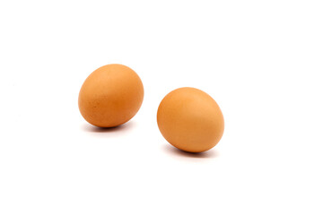 Two brown eggs from a chicken on a white background. Isolated. Photo in high quality.