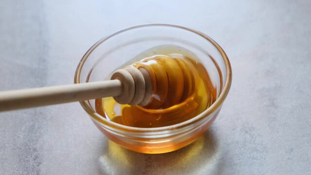 honey dripping from a jar